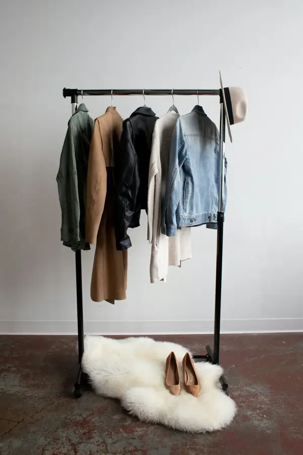 A clothing rail with jackets and denim