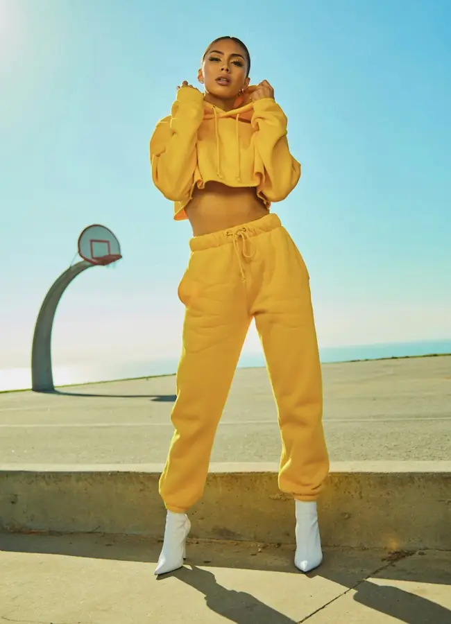 A person modelling a yellow outfit